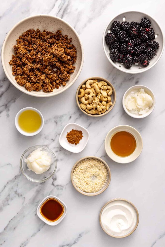 Healthy ingredients for blackberry cobbler bars with fresh berries and coconut