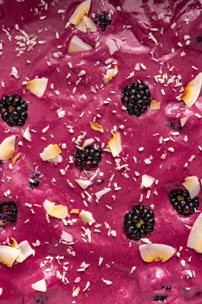 close-up overhead shot of coconut topping on frozen blackberry bars