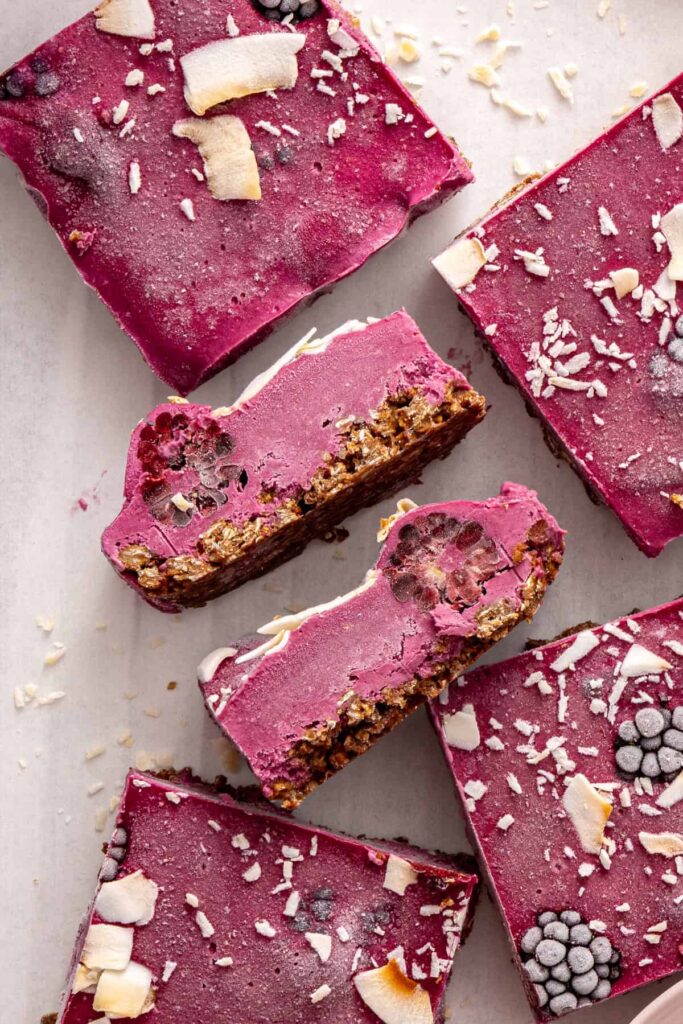 Blackberry cobbler bars arranged on cooling rack with some turned sideways