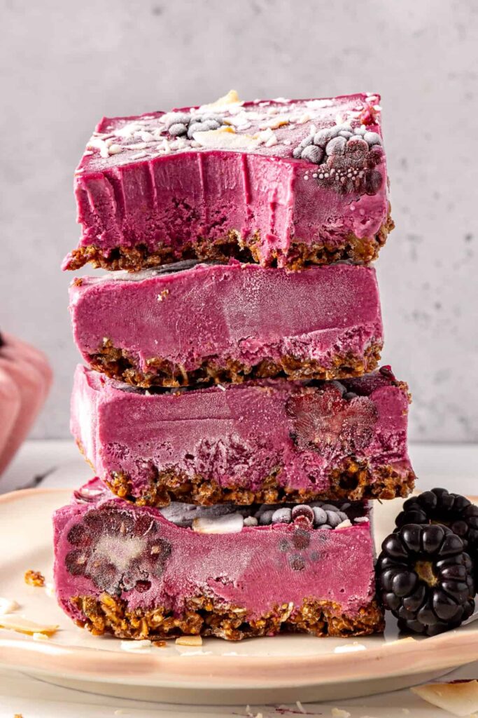Tower of blackberry cobbler bars with coconut topping