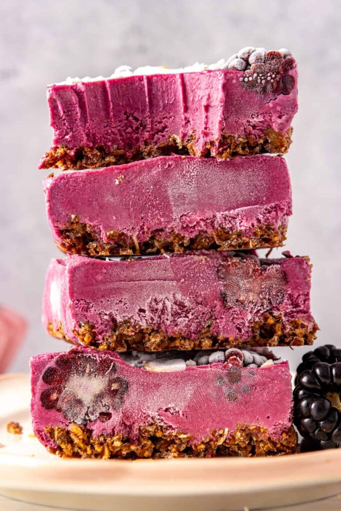 Side view of blackberry cobbler bars showing crust and filling
