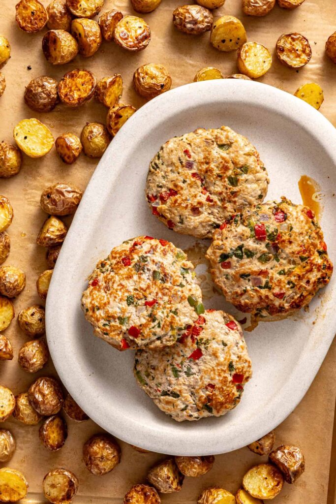 close up of Homemade jalapeño turkey burgers with crispy potatoes