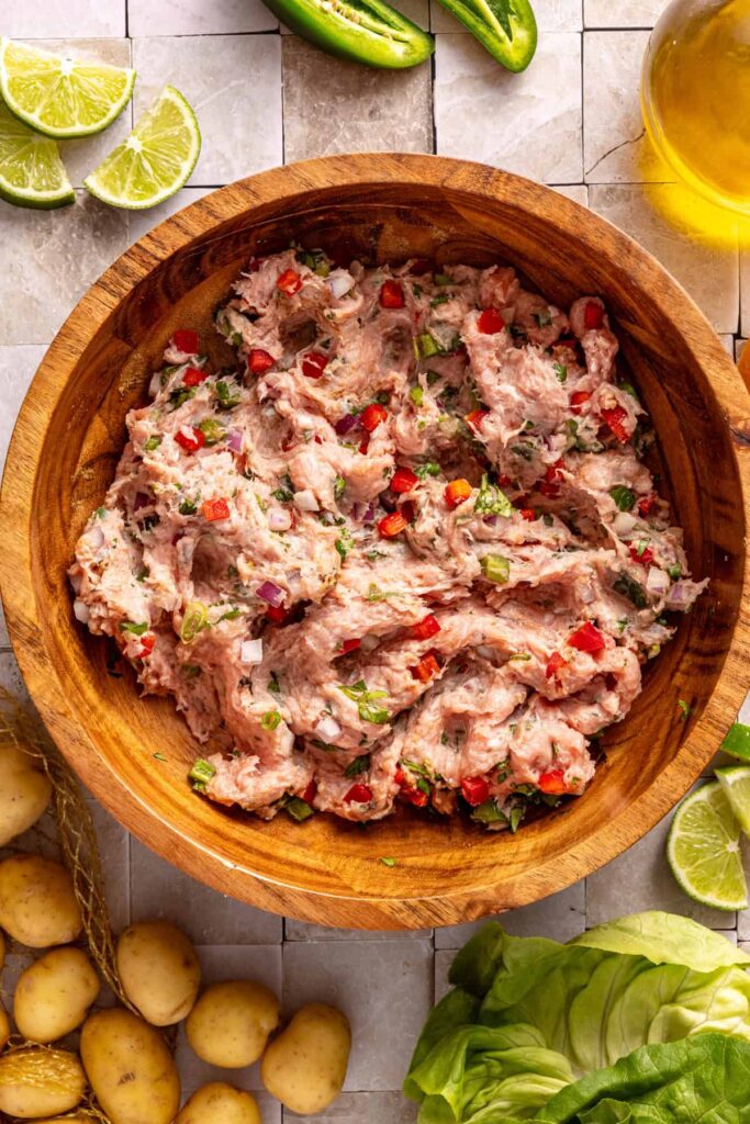 Combining ingredients for homemade jalapeño burgers