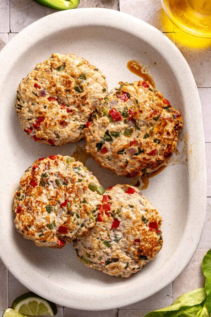 fully cooked jalapeño burgers on serving platter