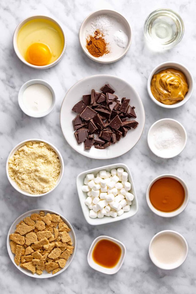 Almond flour, chocolate chips, marshmallows, graham crackers and cashew butter for gluten-free s'mores cookie skillet