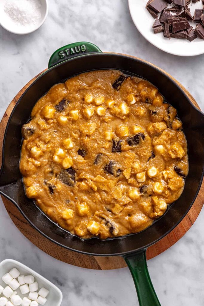 Cookie skillet dough spread evenly into a greased cast-iron skillet