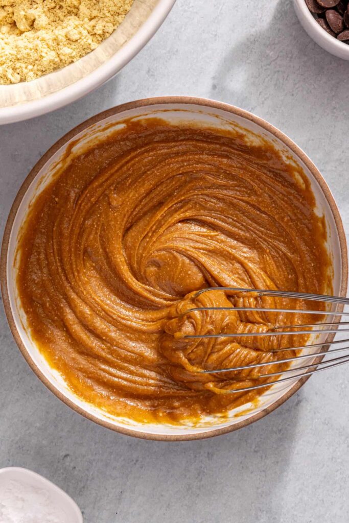 Whisking peanut butter mixture for no-bake peanut butter protein bars