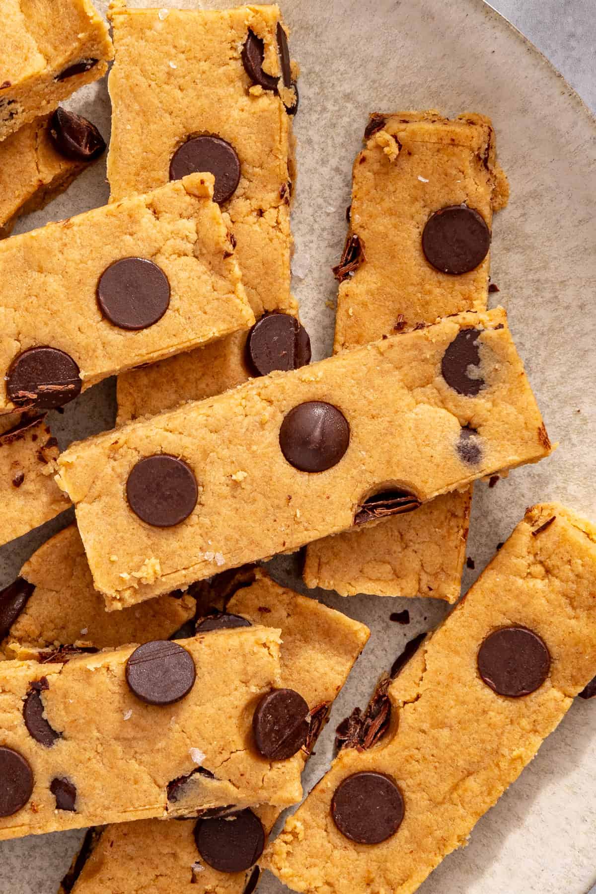 Overhead shot of peanut butter protein bars on white plate