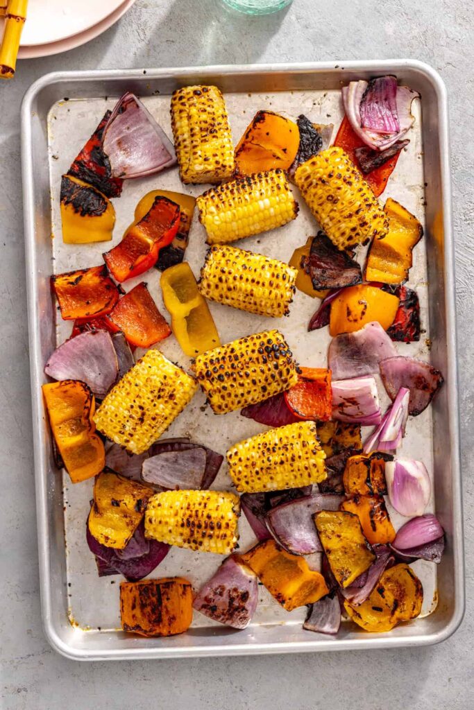 grilled corn, peppers and onions, ready to serve with grilled teriyaki chicken