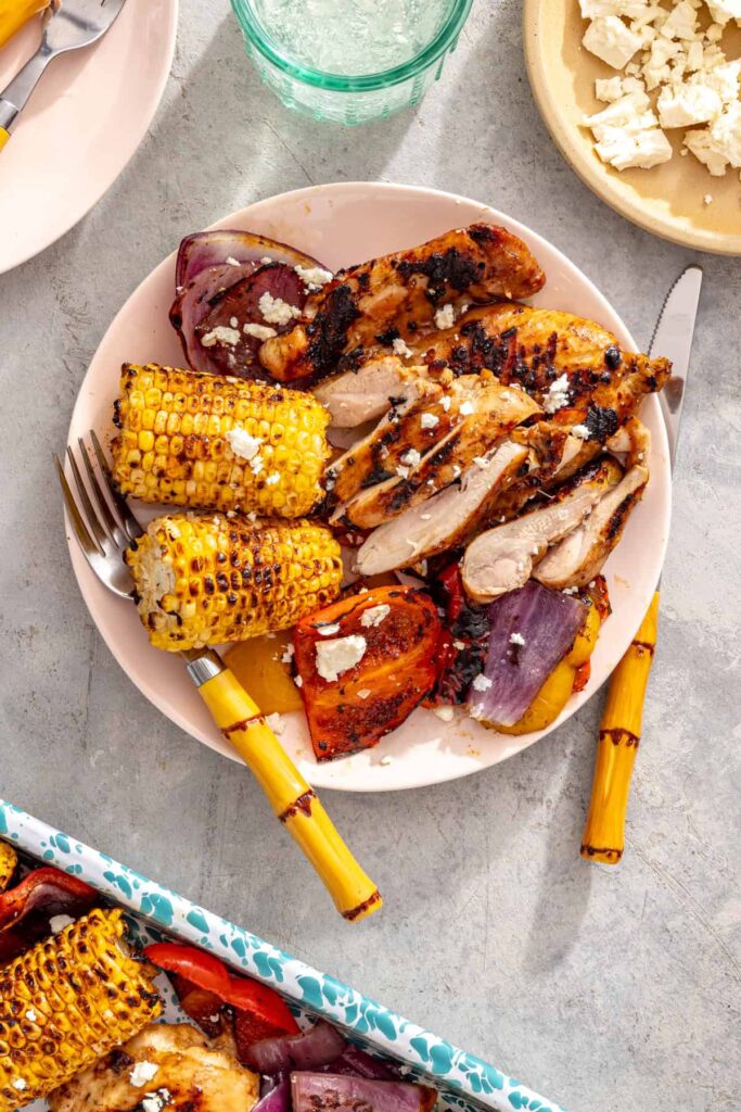 Healthy grilled teriyaki chicken dinner served with grilled vegetables