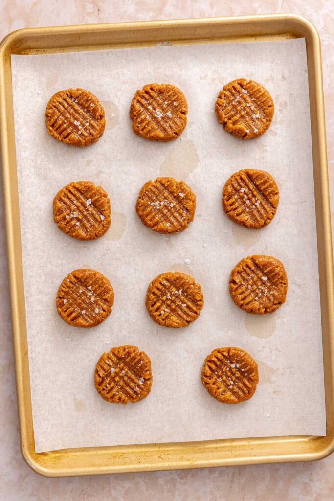 Cookie dough flattened with a fork and sprinkled with flaky sea salt