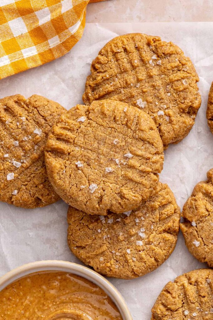 Soft and chewy gluten-free peanut butter cookies served with peanut butter and milk