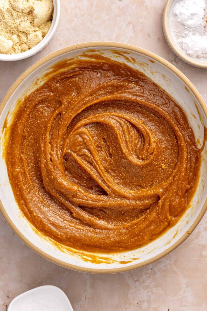 Peanut butter, egg, maple syrup, coconut oil and vanilla whisked together for gluten-free peanut butter cookies