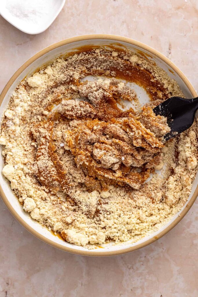 Mixing almond flour into gluten-free peanut butter cookie dough