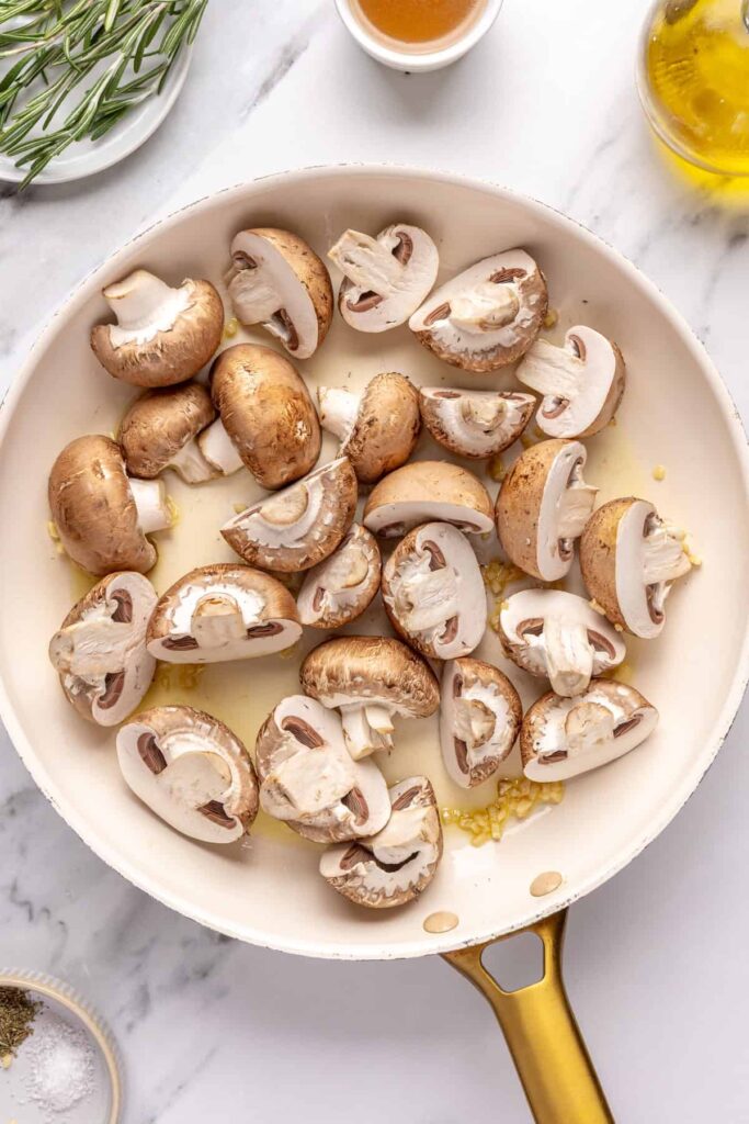 Garlicky mushrooms ready to be cooked in ghee and olive oil