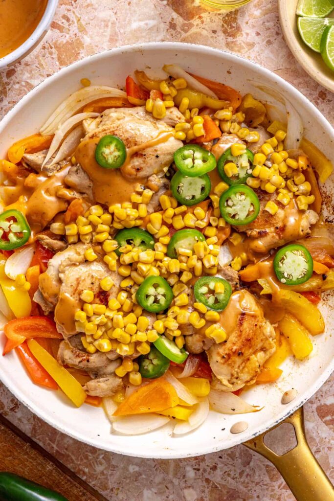Adding corn, jalapeños, and chipotle ranch to southwest chicken skillet
