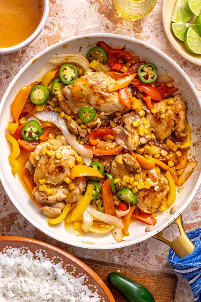 Chicken skillet with corn and peppers coated in creamy chipotle ranch