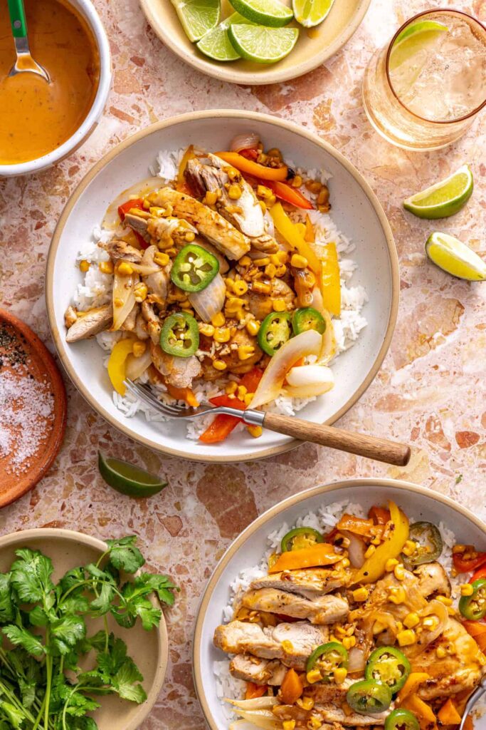Southwest chicken skillet served over rice with jalapeño garnish