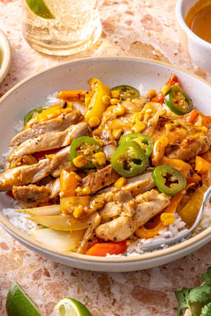 Close-up of southwest chicken skillet with peppers and creamy dressing