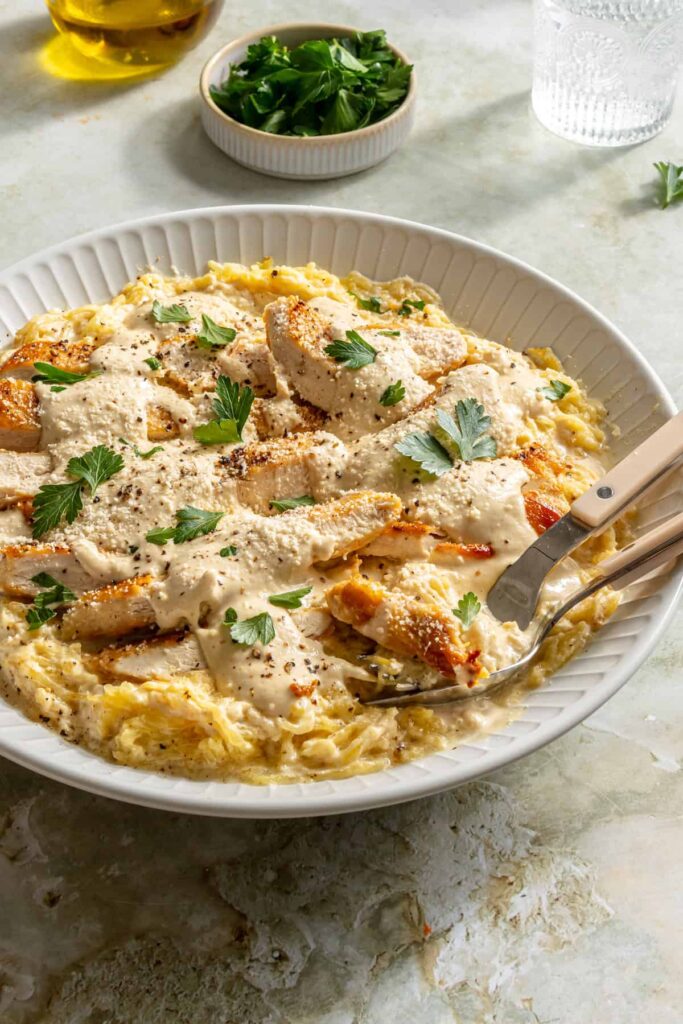 High-protein chicken alfredo served with spaghetti squash