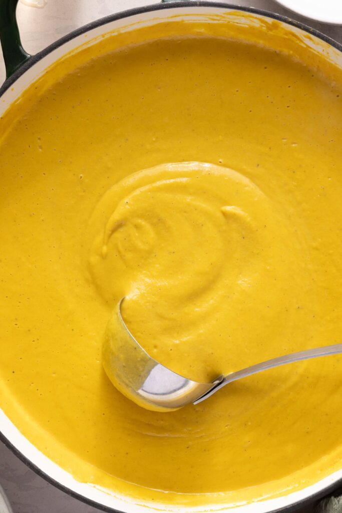 Kabocha cashew curry soup served with pumpkin seed topping – gluten-free, dairy-free recipe