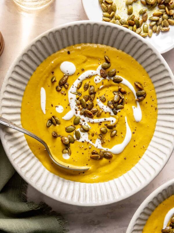 Kabocha curry cashew soup served with pumpkin seed topping – gluten-free, dairy-free recipe