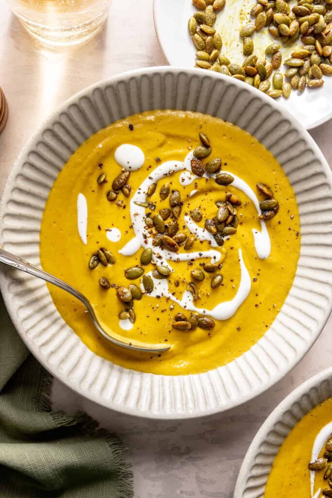 Kabocha curry cashew soup served with pumpkin seed topping – gluten-free, dairy-free recipe