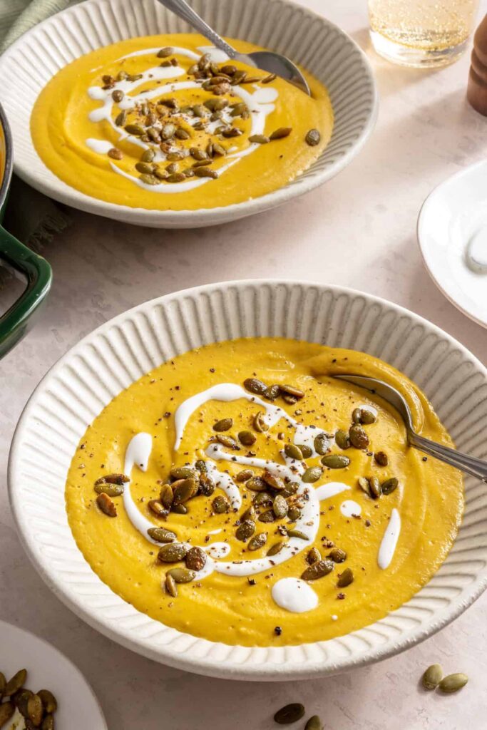 Kabocha cashew curry soup served with pumpkin seed topping – gluten-free, dairy-free recipe