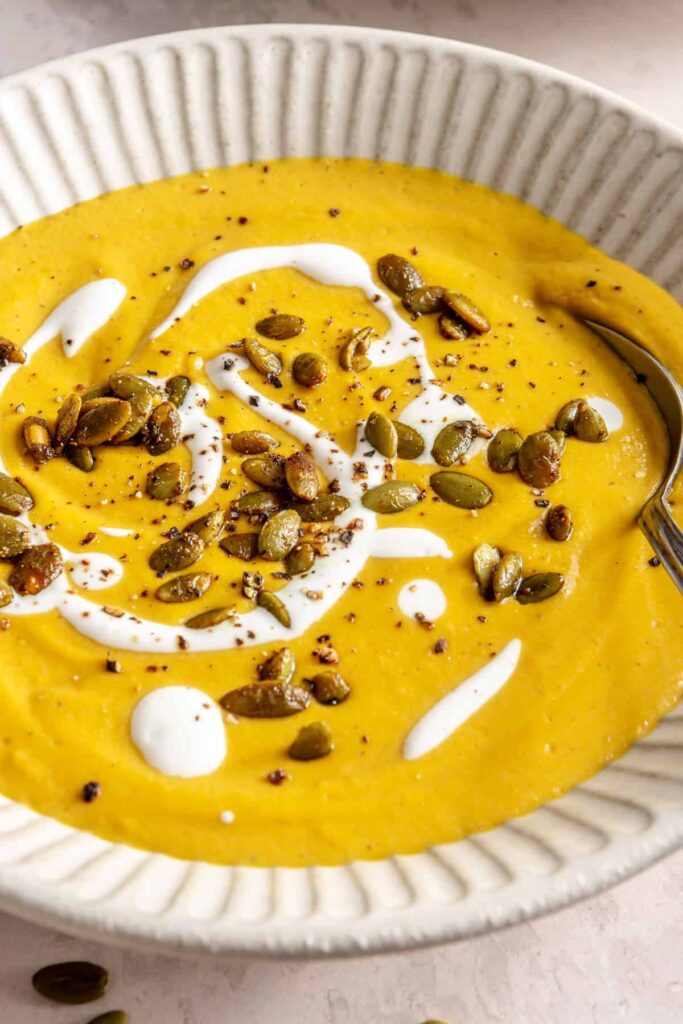 Kabocha cashew curry soup served with pumpkin seed topping – gluten-free, dairy-free recipe