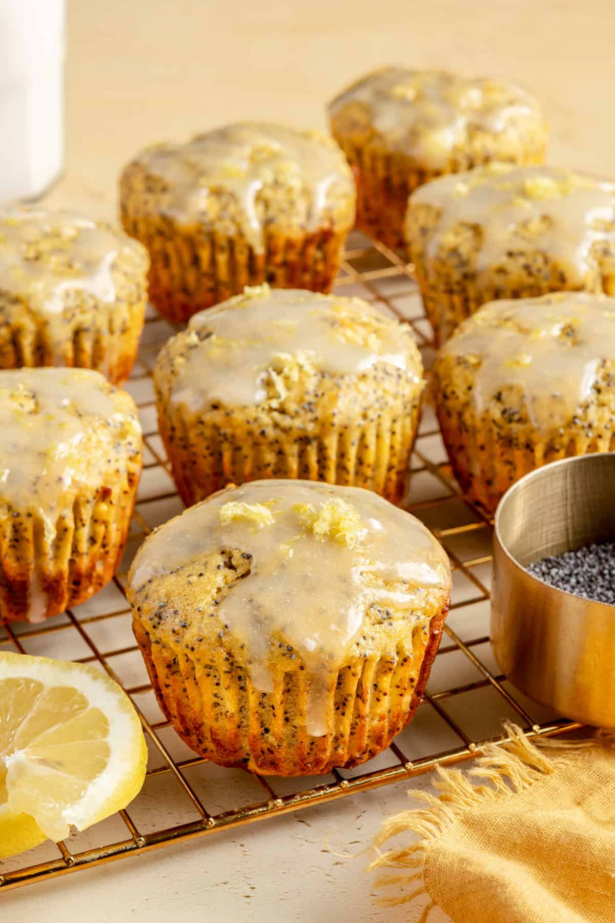 Fluffy lemon poppy seed protein muffins made with almond flour and topped with a homemade coconut butter glaze.