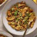Gluten-free honey garlic chicken stir fry with sweet potato glass noodles served in a bowl.