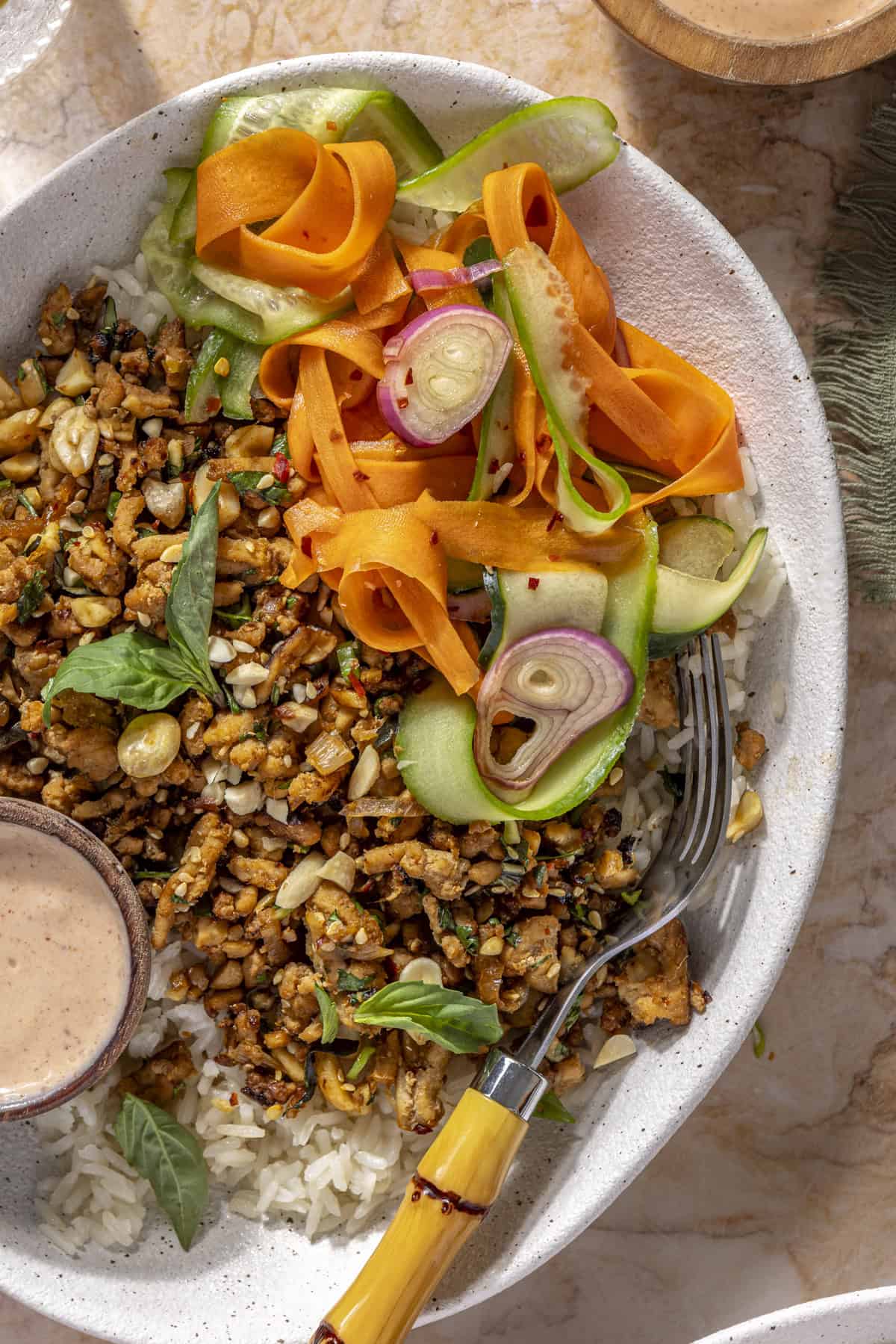 Healthy Chicken Banh Mi Bowl with pickled vegetables, rice, and creamy sriracha sauce – gluten-free and dairy-free