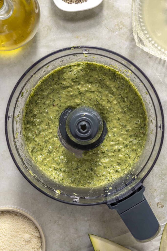 Fresh basil pesto base blended in food processor