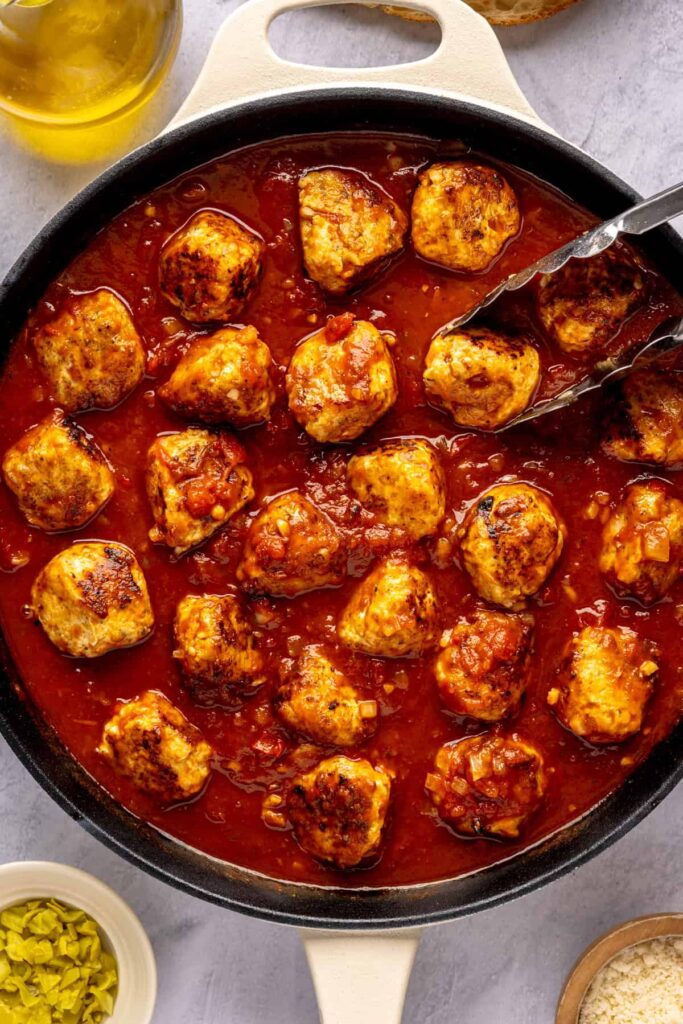 High-protein chicken pesto parmesan meatballs in marinara sauce