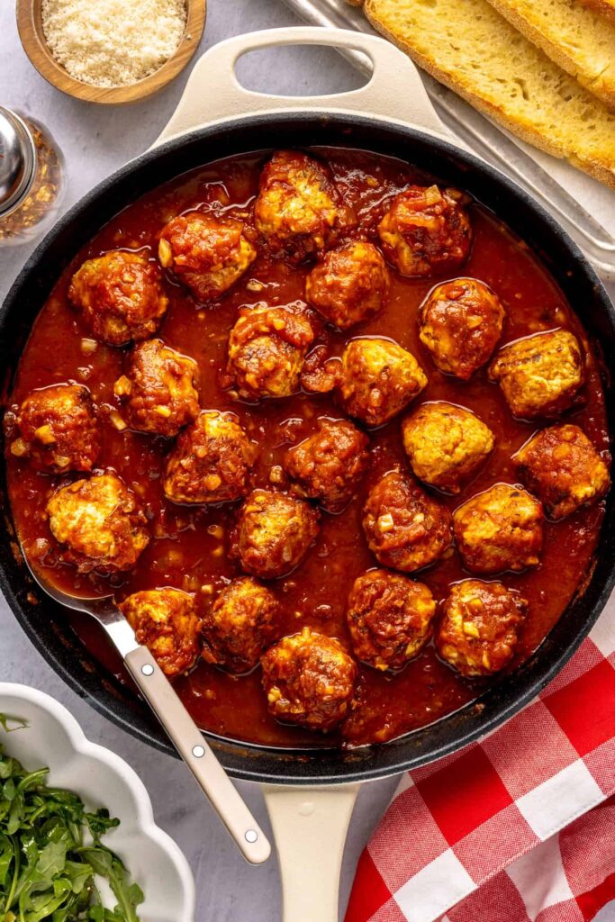 High-protein chicken pesto parmesan meatballs in marinara sauce