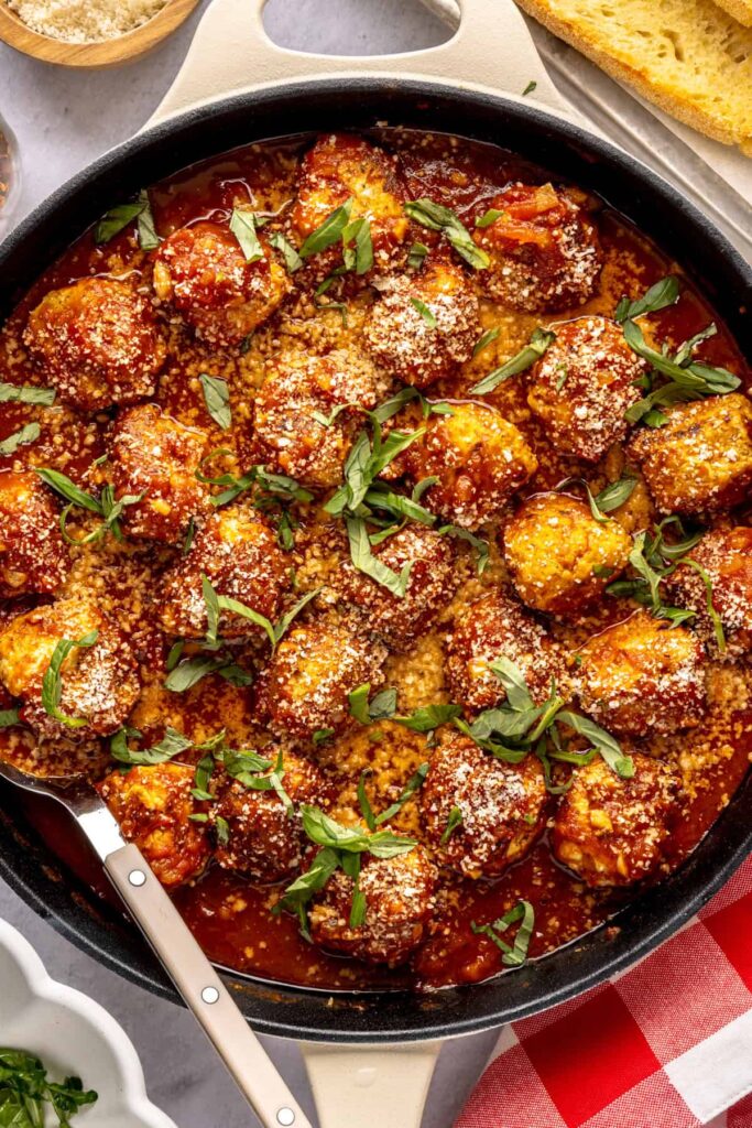 High-protein chicken pesto parmesan meatballs in marinara sauce
