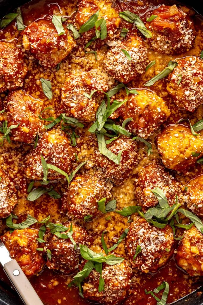 High-protein chicken pesto parmesan meatballs in marinara sauce