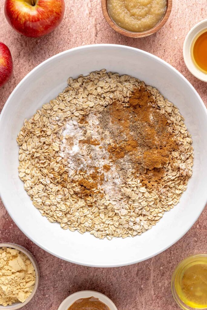 Dry ingredients for baked apple oatmeal in a mixing bowl