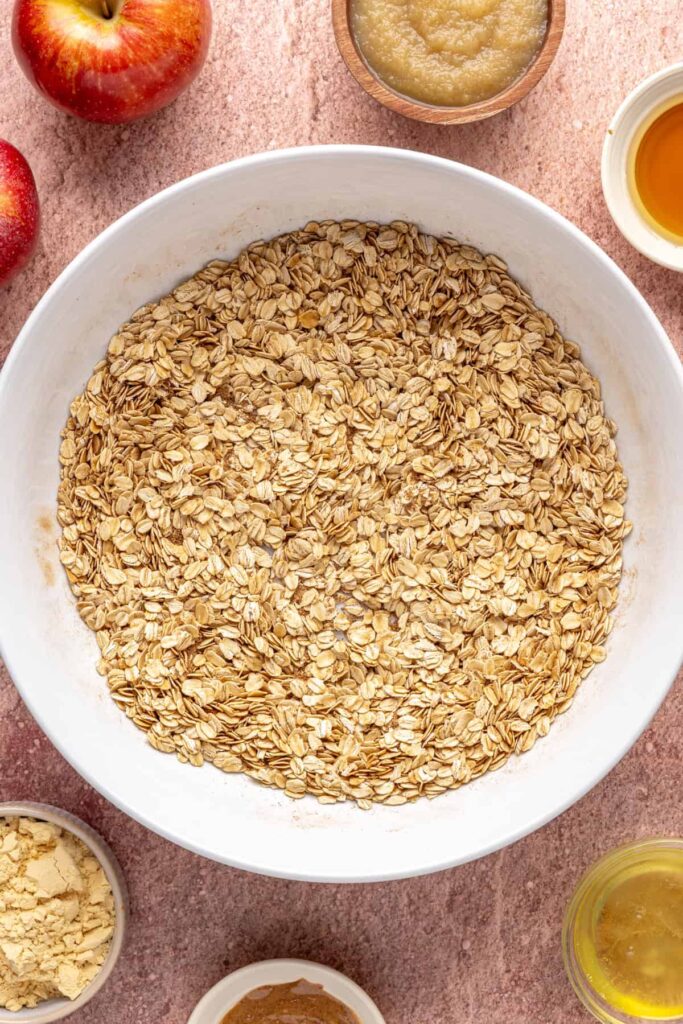 Dry ingredients for baked apple oatmeal in a mixing bowl