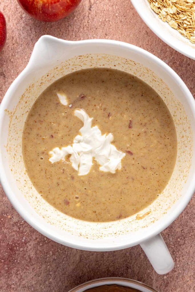Wet ingredients for baked apple oatmeal measured and ready to mix