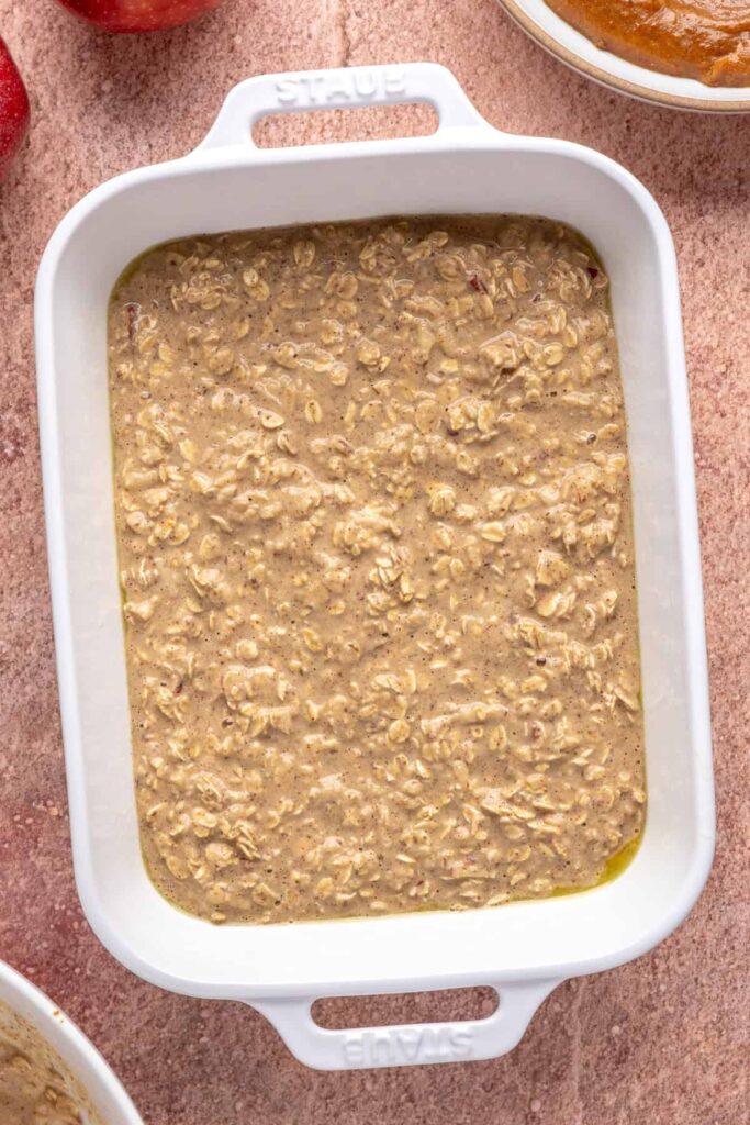 High-protein oatmeal batter for baked apple oatmeal in a baking dish