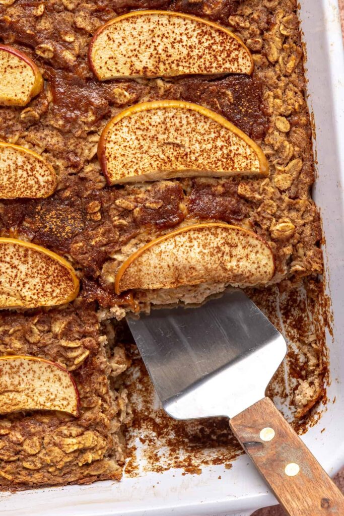 close up of Golden baked apple oatmeal with cinnamon and caramel swirls