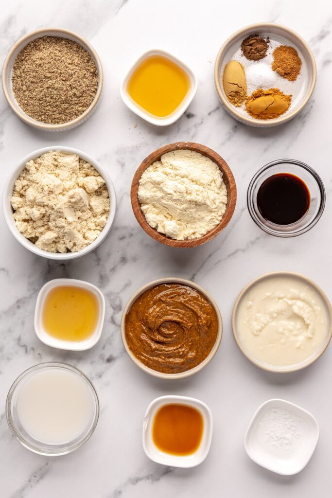Flat lay of dry and wet ingredients for gingerbread protein balls recipe
