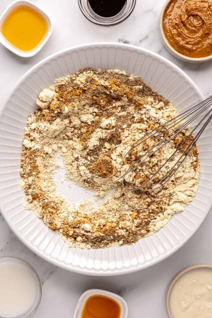 Forming gingerbread protein balls dough by combining wet and dry ingredients