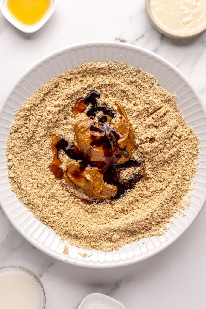 Almond butter with molasses and maple syrup, ready to mix with almond flour mixture, for gingerbread protein balls