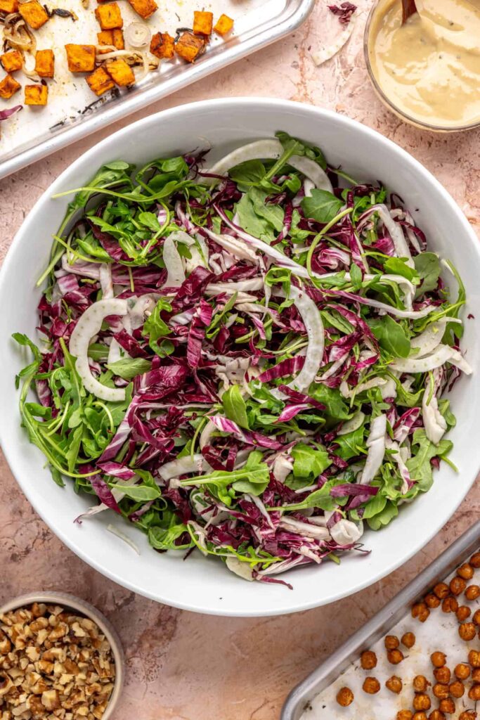 Thinly sliced radicchio and frisée for harvest salad base