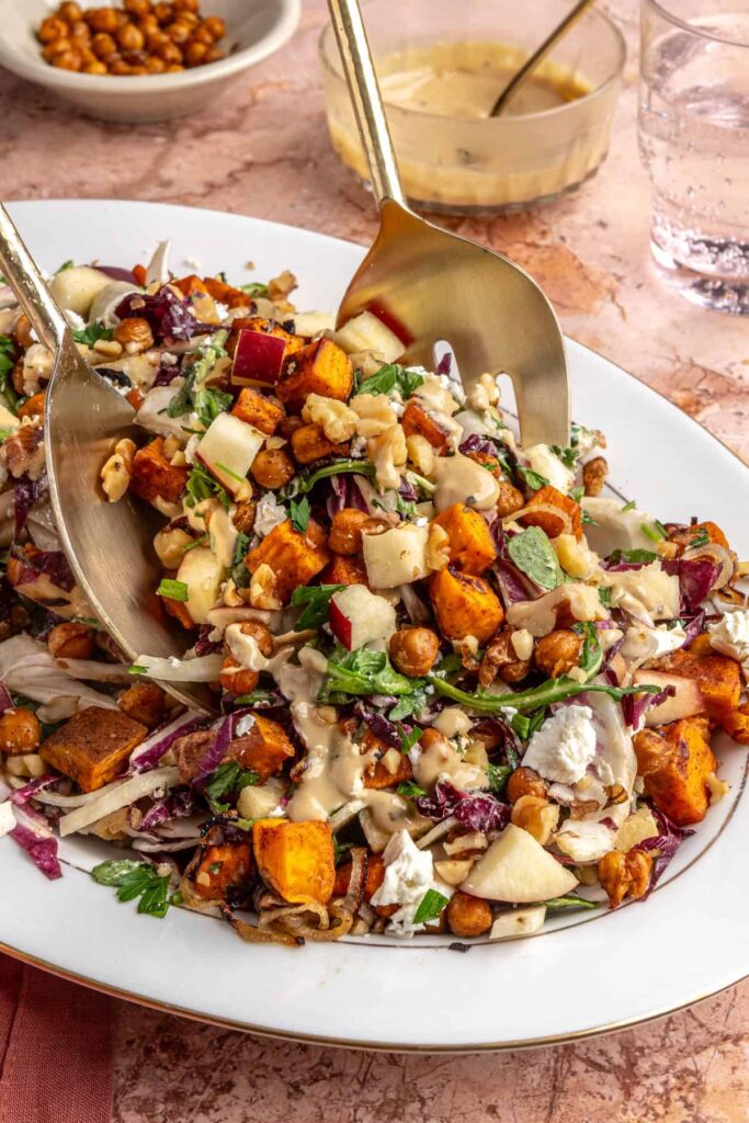 Ultimate harvest salad with roasted sweet potatoes, chickpeas, apples, and creamy tahini dressing
