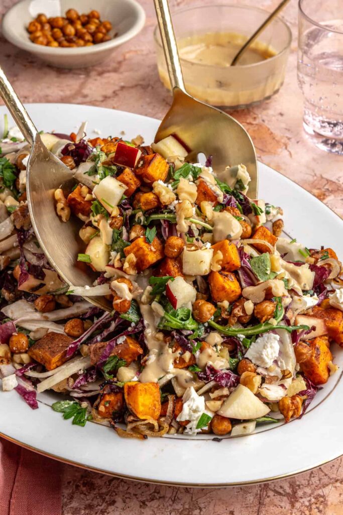 Ultimate harvest salad with roasted sweet potatoes, chickpeas, apples, and creamy tahini dressing