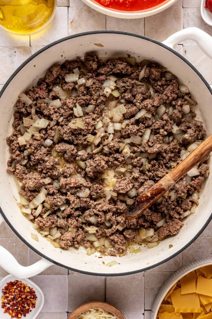 browning the ground beef with the sautéed aromatics for lasagna soup including onions and garlic