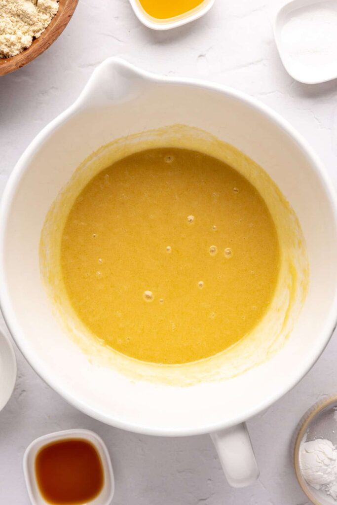 wet ingredients mixed together in a bowl for gluten-free, refined-sugar free Christmas Sugar Cookies